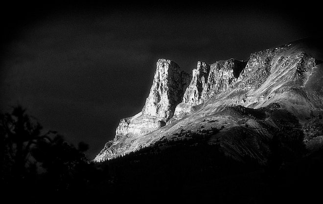MOUNTAIN SLOPES IN THE CANADIAN ROCKIES SUNLIT AND IN BLACK AND WHITE IMAGE FOR SALE