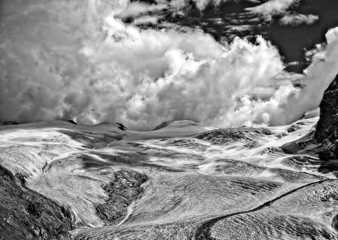 CLOUDS, IACE AND ROCKS IN THE SWISS ALPS IN BLACK AND WHITE